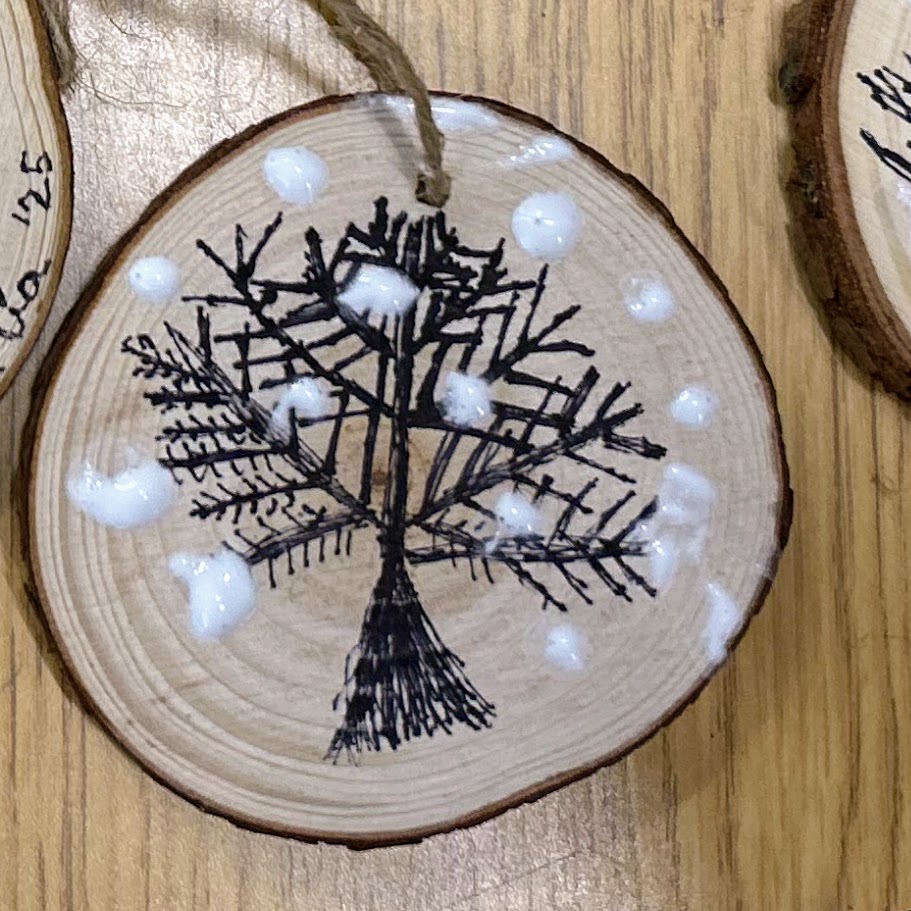 student made ornament with a tree on it. 